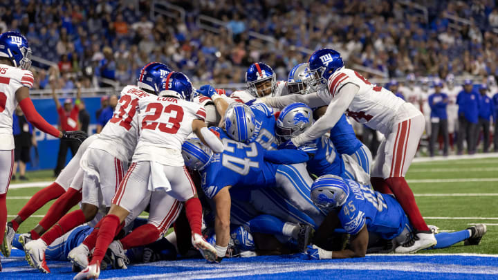 Aug 11, 2023; Detroit, Michigan, USA; Detroit Lions quarterback Adrian Martinez (18) scores the game-winning touchdown against the New York Giants in the fourth quarter at Ford Field.  