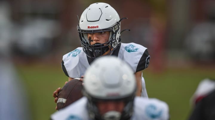 Jensen Beach quarterback Johnny Ahern (background) rallied his team, after a scoreless first half, to a 9-7 win over Treasure Coast, Thursday night in Florida.