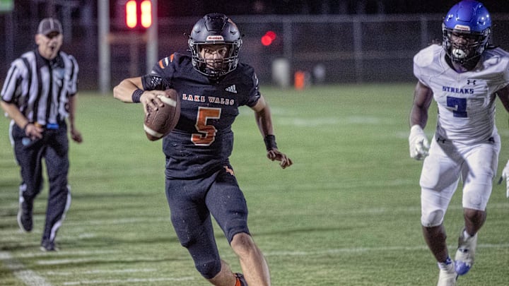 Lake Wales quarterback Brycen Levidiotis runs for a first down against Sebring, but the play was called back because of a penalty.