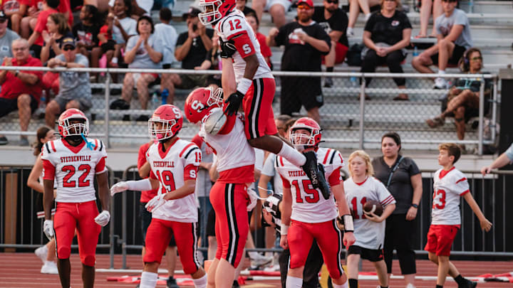Steubenville's Tre'Von Wiggins, 12, is hoisted into the air after making a touchdown during a game against New Philadelphia, Friday, Aug. 30 at Woody Hayes Quaker Stadium. Steubenville's Tre'Von Wiggins, 12, is hoisted into the air after making a touchdown during a game against New Philadelphia, Friday, Aug. 30 at Woody Hayes Quaker Stadium.