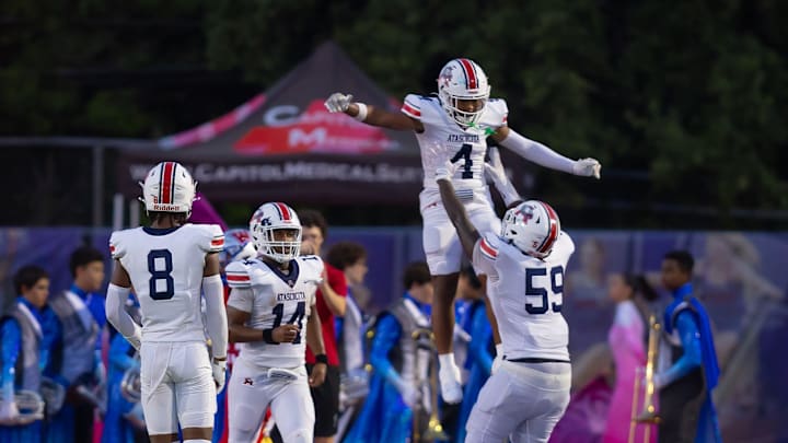 Atascosita Eagles wide receiver CJ Toney (4) celebrates his touchdown by center Daitwone Williams (59) against the Westlake Chaparrals during the second quarter the non-district Class 6A football game on Friday, Sept 13, 2024, at Westlake High School in West Lake Hills, TX.