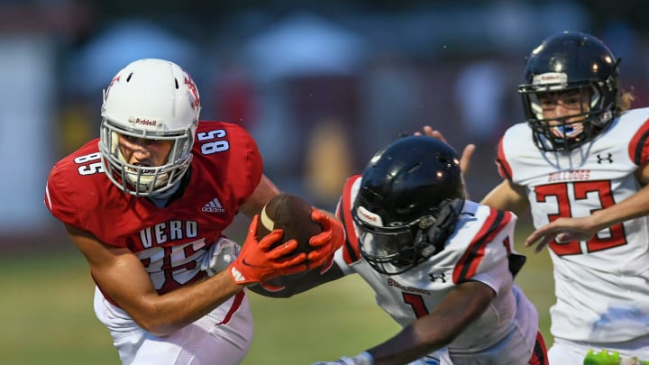 Vero Beach High School's Nate Guinn (from left) sprints away from South Fork's Li'montay Delancey and Michael Crites as the Vero Beach High School Fighting Indians take on the South Fork Bulldogs on Friday, Aug. 26, 2022, at Billy Livings Field at the Citrus Bow in Vero Beach. Vero Beach won 54-6.

Tcn Friday Hs Football Week 1 Vb Vs Sf