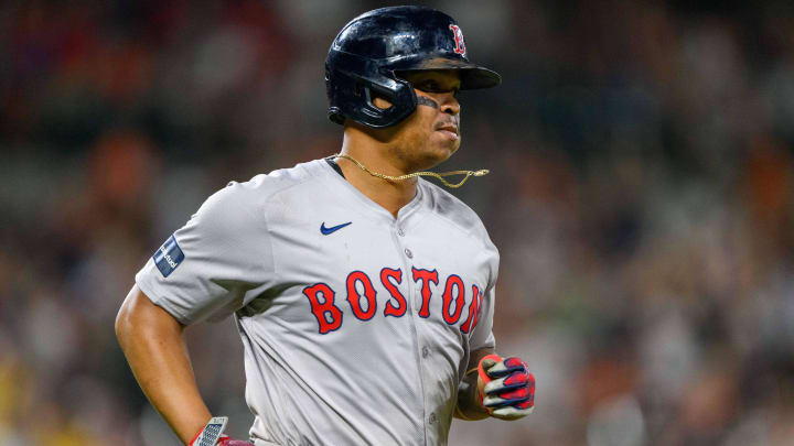 Aug 17, 2024; Baltimore, Maryland, USA; Boston Red Sox third baseman Rafael Devers (11) runs to first base after hitting a home run during the eighth inning against the Baltimore Orioles at Oriole Park at Camden Yards. Mandatory Credit: Reggie Hildred-USA TODAY Sports