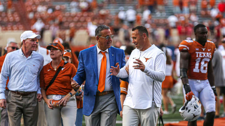 University of Texas at Austin athletic director Chris Del Conte, left, talks to head coach Steve Sarkisian after Texas's game against Louisiana at Darrell K. Royal Stadium on Sept. 4, 2021. Texas won the game 38-18.

Sark