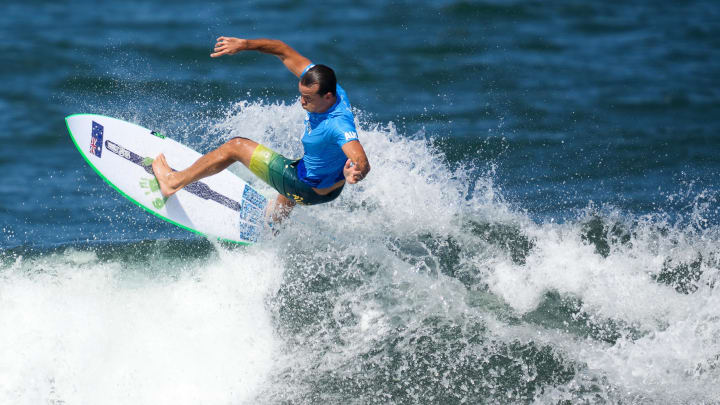 Jul 25, 2021; Tokyo, Japan; Julian Wilson (AUS) surfs in men   s round two competition during the Tokyo 2020 Olympic Summer Games at Tsurigasaki Surfing Beach.