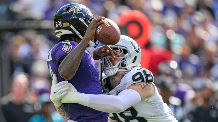 Las Vegas Raiders defensive end Maxx Crosby (98) sacks Baltimore Ravens quarterback Lamar Jackson (8) during the second half at M&T Bank Stadium. 