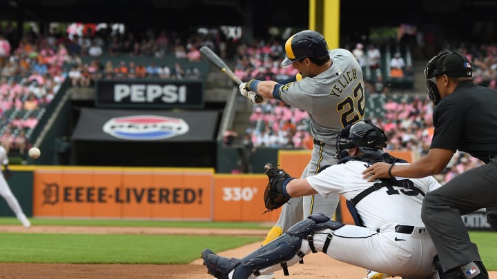 Jun 8, 2024; Detroit, Michigan, USA;  Milwaukee Brewers designated hitter Christian Yelich (22) hits an RBI single against the Detroit Tigers in the first inning at Comerica Park. Mandatory Credit: Lon Horwedel-USA TODAY Sports