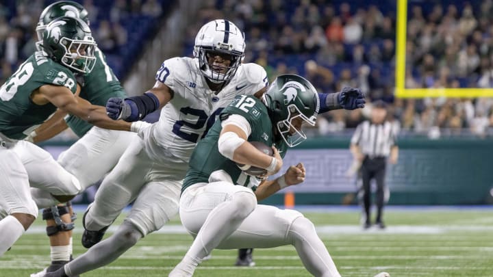 Nov 24, 2023; Detroit, Michigan, USA; Penn State Nittany Lions defensive end Adisa Isaac (20) pressures and sacks Michigan State Spartans quarterback Katin Houser (12) during the second half at Ford Field. Mandatory Credit: David Reginek-USA TODAY Sports