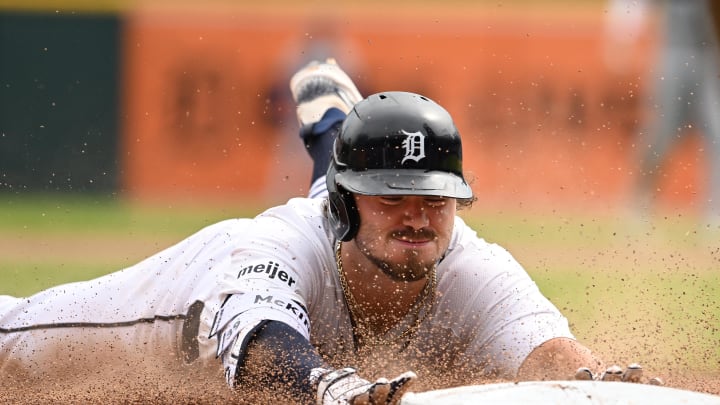 Jul 14, 2024; Detroit, Michigan, USA;  Detroit Tigers shortstop Zach McKinstry (39) slides safely into third base for a lead off triple against the Los Angeles Dodgers in the ninth inning at Comerica Park.