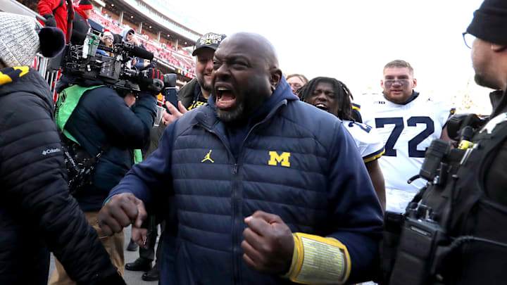 Nov 30, 2024; Columbus, Ohio, USA; Michigan Wolverines coach Tony Alford reacts to fans heckling him after the game against the Ohio State Buckeyes at Ohio Stadium. Mandatory Credit: Joseph Maiorana-Imagn Images Nov 30, 2024; Columbus, Ohio, USA; Michigan Wolverines coach Tony Alford reacts to fans heckling him after the game against the Ohio State Buckeyes at Ohio Stadium. Mandatory Credit: Joseph Maiorana-Imagn Images