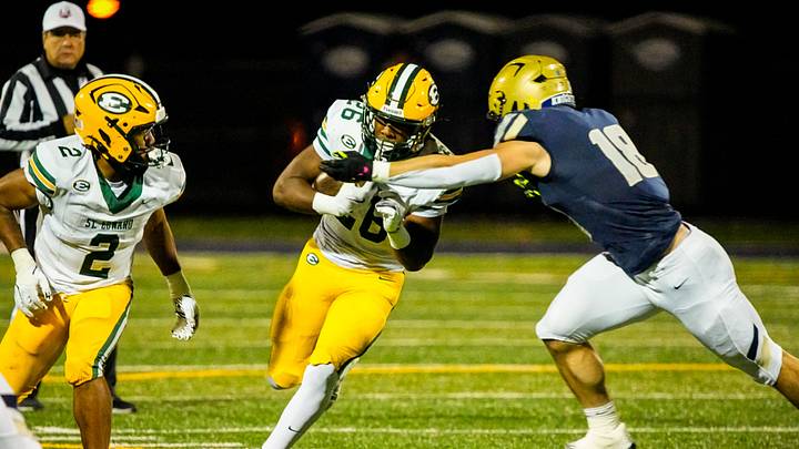 St. Edward's Tyrese Buchanan is tackled by Hoban’s Brayton Feister, Oct. 24, 2025.