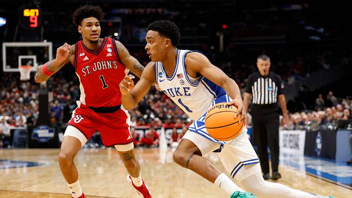 Mar 27, 2026; Washington, DC, USA; Duke Blue Devils guard Caleb Foster (1) dribbles the ball past St. John's Red Storm forward Dillon Mitchell (1) in the second half during a Sweet Sixteen game of the East Regional of the men's 2026 NCAA Tournament at Capital One Arena. Mandatory Credit: Geoff Burke-Imagn Images