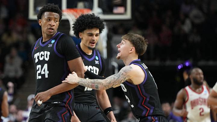 Mar 19, 2026; Greenville, SC, USA; Texas Christian University Horned Frogs forward Xavier Edmonds (24) reacts with guard Brock Harding (2) in the second half during a first round game of the men's 2026 NCAA Tournament at Bon Secours Wellness Arena. Mandatory Credit: Bob Donnan-Imagn Images