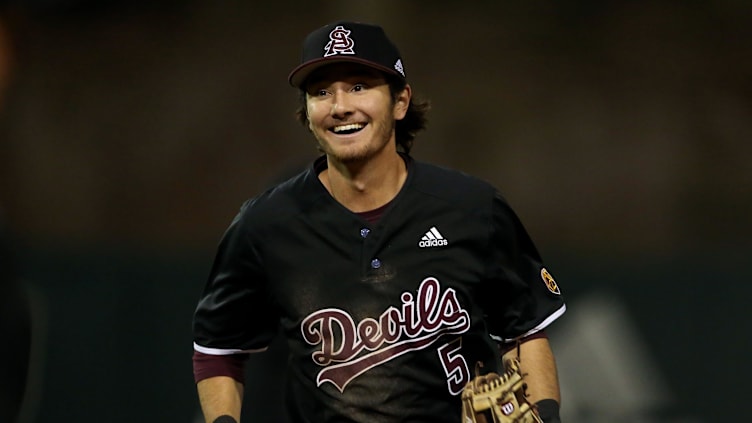 ASU second baseman Alika Williams (5) smiles coming off the field during their game against