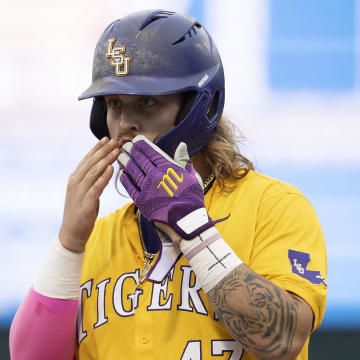 Jun 2, 2024; Chapel Hill, NC, USA;  Louisiana State Tigers third baseman Tommy White (47) reacts to getting a base hit in the fifth inning against the North Carolina Tar Heels during the Div. I NCAA baseball regional at Boshamer Stadium. 