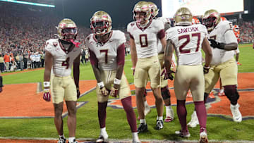 Nov 8, 2025; Clemson, South Carolina, USA; Florida State Seminoles receiver Lawayne McCoy (7) celebrates with teammates after scoring against the Clemson Tigers during the second quarter at Memorial Stadium. Mandatory Credit: Ken Ruinard - GREENVILLE NEWS-USA TODAY Network via Imagn Images