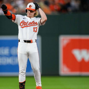 Jun 30, 2024; Baltimore, Maryland, USA; Baltimore Orioles outfielder Heston Kjerstad (13) reacts after hitting a double during the fourth inning against the Texas Rangers at Oriole Park at Camden Yards.