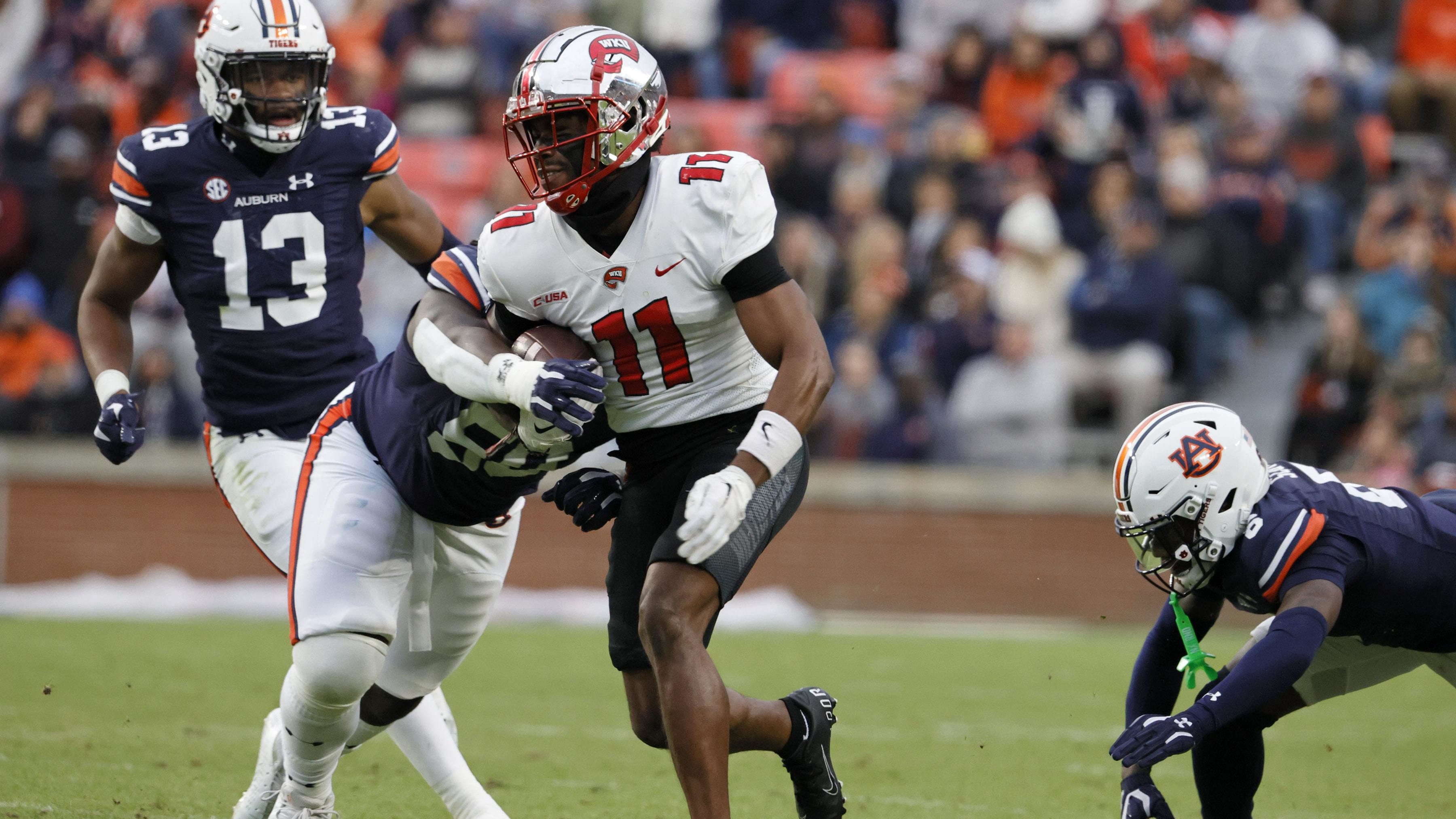 Western Kentucky Hilltoppers wide receiver Malachi Corley (11) runs through traffic after the catch.