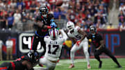 Oct 6, 2024; Houston, Texas, USA;  Buffalo Bills quarterback Josh Allen (17) is pressured by Houston Texans linebacker Azeez Al-Shaair (0)  in the second half at NRG Stadium. Mandatory Credit: Thomas Shea-Imagn Images