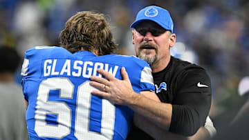 Dec 5, 2024; Detroit, Michigan, USA; Detroit Lions head coach Dan Campbell greets guard Graham Glasgow (60) during pregame warmups before their game against the Green Bay Packers at Ford Field. Mandatory Credit: Lon Horwedel-Imagn Images