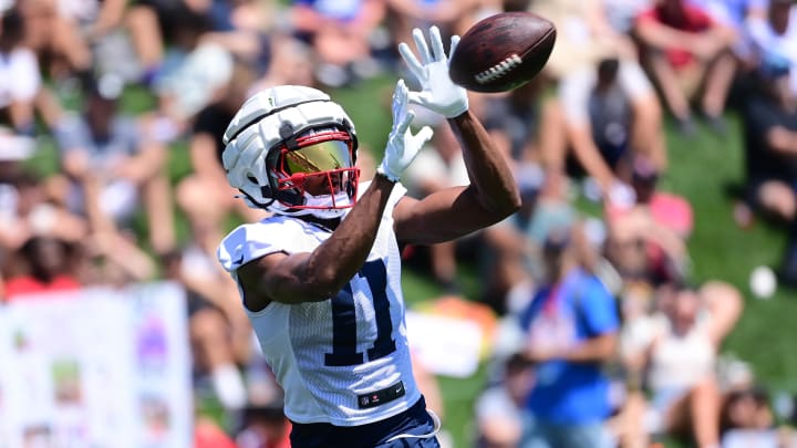 Jul 26, 2024; Foxborough, MA, USA; New England Patriots wide receiver Tyquan Thornton (11) makes a catch during training camp at Gillette Stadium. Mandatory Credit: Eric Canha-USA TODAY Sports