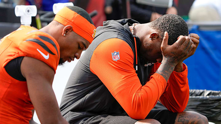 Cincinnati Bengals Ja'Marr Chase and Tee Higgins who was inactive for the Bengals sit on the sideline as their team is defeated by the New England Patriots 16-10 at Paycor Stadium Sunday, September 8, 2024.