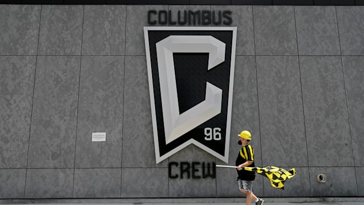 Nick Auddino, of Westerville, walks in front of a Columbus Crew logo on the west side of Lower.com Field before attending the inaugural match between the Columbus Crew and the New England Revolution in Columbus on Saturday, June 1, 2021. Auddino is a longtime Crew supporter who has only missed one game for the birth of his son. His children Jordan, 12, and Laina, 6, Auddino, were attending the match with him.

Ceb Crew 0705 Bjp 01