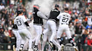 Detroit Tigers first baseman Spencer Torkelson (20) gets swarmed by his teammates after hitting a walk-off double against the Chicago White Sox at Comerica Park. 