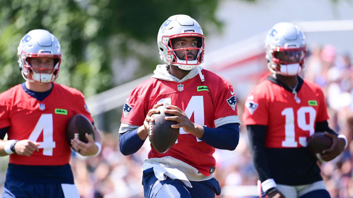 Jul 26, 2024; Foxborough, MA, USA; New England Patriots quarterback Jacoby Brissett (14) throws a pass during training camp at Gillette Stadium. Mandatory Credit: Eric Canha-USA TODAY Sports