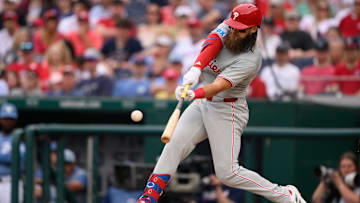 Mar 29, 2025; Washington, District of Columbia, USA; Philadelphia Phillies outfielder Brandon Marsh (16) hits a single during the sixth inning against the Washington Nationals at Nationals Park. 