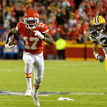 Kansas City Chiefs wide receiver Mecole Hardman (17) runs with the ball against Tramon Williams and the Packers in 2019.