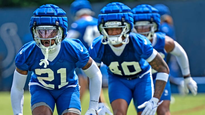 Colts players, including Dallis Flowers (21) and Jaylon Jones (40) run drills during Indianapolis Colts minicamp practice Tuesday, June 4, 2024 at the Indiana Farm Bureau Football Center.