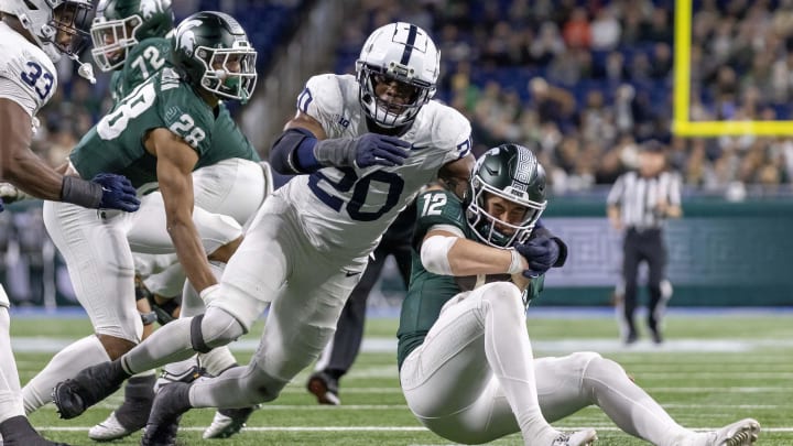 Nov 24, 2023; Detroit, Michigan, USA; Penn State Nittany Lions defensive end Adisa Isaac (20) pressures and sacks Michigan State Spartans quarterback Katin Houser (12) during the second half at Ford Field. Mandatory Credit: David Reginek-USA TODAY Sports