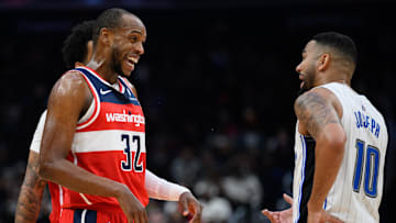 Mar 21, 2025; Washington, District of Columbia, USA; Washington Wizards forward Khris Middleton (32) and Orlando Magic guard Cory Joseph (10) react during the fourth quarter at Capital One Arena. Mandatory Credit: Reggie Hildred-Imagn Images