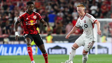 Toronto FC midfielder Matty Longstaff (8) moves the ball against New York Red Bulls forward Cory Burke (7)  