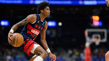 Mar 24, 2025; Washington, District of Columbia, USA; Washington Wizards guard AJ Johnson (5) handles the ball during the fourth quarter against the Toronto Raptors at Capital One Arena. Mandatory Credit: Reggie Hildred-Imagn Images