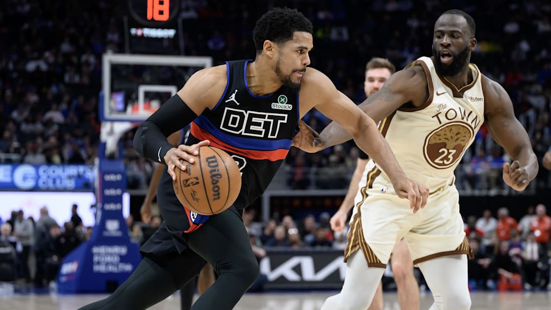 Mar 20, 2026; Detroit, Michigan, USA;  Detroit Pistons forward Tobias Harris (12) drives past Golden State Warriors forward Draymond Green (23) in the first half at Little Caesars Arena. Mandatory Credit: Lon Horwedel-Imagn Images