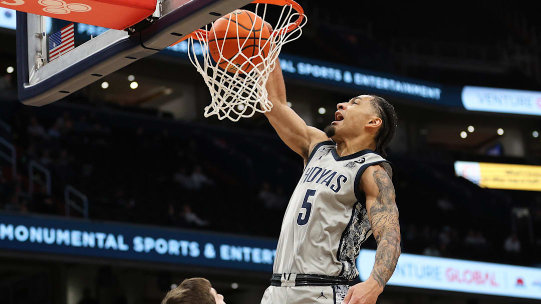 Feb 19, 2025; Washington, District of Columbia, USA; Georgetown Hoyas guard Micah Peavy (5) dunks during the first half against the Providence Friars at Capital One Arena. Mandatory Credit: Daniel Kucin Jr.-Imagn Images