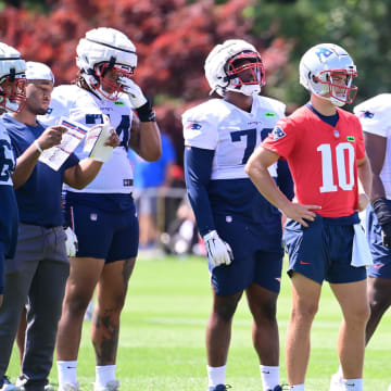 Jul 26, 2024; Foxborough, MA, USA; New England Patriots quarterback Drake Maye (10) waits for a drill to start during training camp at Gillette Stadium. Mandatory Credit: Eric Canha-USA TODAY Sports