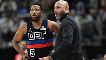 Detroit Pistons head coach J.B. Bickerstaff talks with guard Malik Beasley (5) during the game against the Toronto Raptors in the third quarter at Little Caesars Arena.