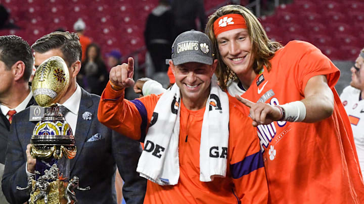 Clemson Head Coach Dabo Swinney and Clemson quarterback Trevor Lawrence (16) celebrate a 29-23 win over Ohio State at the PlayStation Fiesta Bowl at State Farm Stadium in Glendale, Arizona Saturday, December 28, 2019.

Clemson Vs Ohio State Fiesta Bowl
