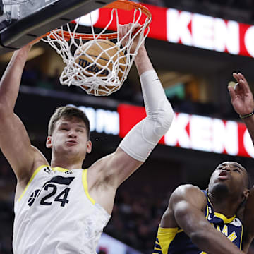 Dec 2, 2022; Salt Lake City, Utah, USA; Utah Jazz center Walker Kessler (24) gets the dunk and the foul against Indiana Pacers forward Aaron Nesmith (23) in the fourth quarter at Vivint Arena. Mandatory Credit: Jeffrey Swinger-Imagn Images


