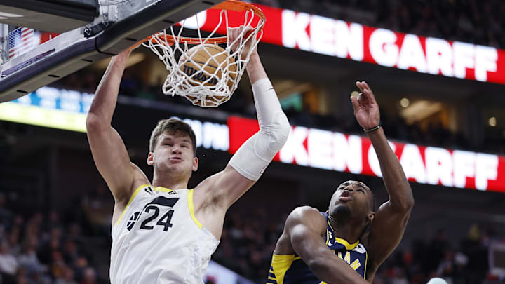 Dec 2, 2022; Salt Lake City, Utah, USA; Utah Jazz center Walker Kessler (24) gets the dunk and the foul against Indiana Pacers forward Aaron Nesmith (23) in the fourth quarter at Vivint Arena. Mandatory Credit: Jeffrey Swinger-Imagn Images


