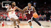 Nov 10, 2023; Columbus, Ohio, USA;  Texas A&M Aggies guard Wade Taylor IV (4) dribbles the ball as Ohio State Buckeyes guard Evan Mahaffey (12) defends during the first half at Value City Arena. Mandatory Credit: Joseph Maiorana-Imagn Images