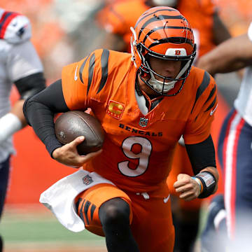 Sep 8, 2024; Cincinnati, Ohio, USA; Cincinnati Bengals quarterback Joe Burrow (9) runs the ball during the third quarter against the New England Patriots at Paycor Stadium. Mandatory Credit: Joseph Maiorana-Imagn Images