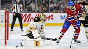 Apr 3, 2025; Montreal, Quebec, CAN; Boston Bruins goalie Jeremy Swayman (1) stops Montreal Canadiens forward Jake Evans (71) during the second period at the Bell Centre. Mandatory Credit: Eric Bolte-Imagn Images