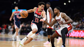Mar 31, 2024; Washington, District of Columbia, USA; Washington Wizards guard Jordan Poole (13) drives to the basket against Miami Heat forward Haywood Highsmith (24) during the third quarter at Capital One Arena. Mandatory Credit: Reggie Hildred-Imagn Images