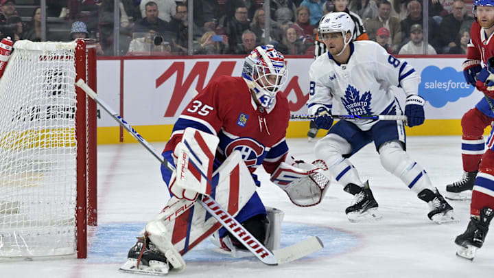 Oct 9, 2024; Montreal, Quebec, CAN; Montreal Canadiens goalie Sam Montembeault (35) stops the puck in front of Toronto Maple Leafs forward William Nylander (88) during the first period at the Bell Centre. Mandatory Credit: Eric Bolte-Imagn Images