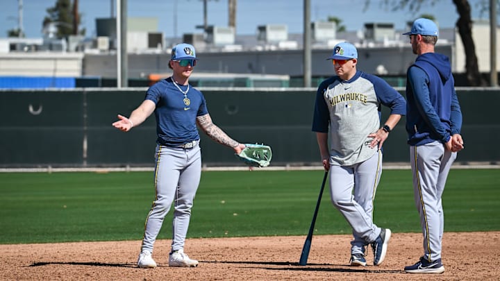 Milwaukee Brewers infielder/outfielder Jett Williams (76) works with Nashville Sounds bench coach David Tufo, center, and infield coordinator Andrew Romine at third base during spring training workouts Saturday, February 14, 2026, at American Family Fields of Phoenix in Phoenix, Arizona.