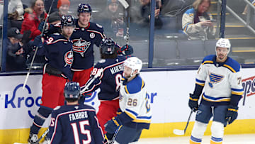 Jan 4, 2025; Columbus, Ohio, USA;  Columbus Blue Jackets left wing Dmitri Voronkov (back middle) celebrates with center Adam Fantilli (19) and right wing Kirill Marchenko (86) after scoring a goal against the St. Louis Blues during the third period at Nationwide Arena. Mandatory Credit: Joseph Maiorana-Imagn Images